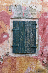 Shutters on a window of an old building in Paxoi island, Greece