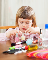 Little girl paints her nails