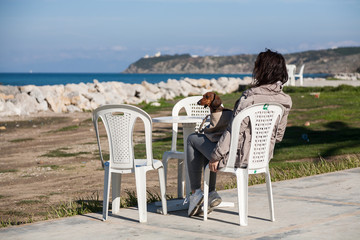 Women  with dachshund dog