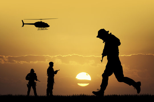 soldiers silhouette at sunset