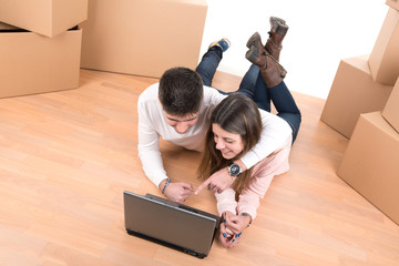 Happy couple with boxes