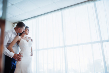 Wedding couple in hotel room