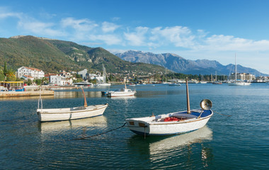 Fototapeta na wymiar Boats in Bay of Kotor. Tivat city, Montenegro