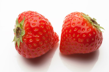 two strawberrys on white