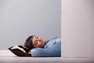 sleeping relaxed on the floor on a pillow