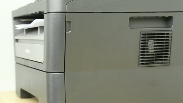 View of printer printing pages