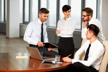 Business People. Successful business partners discuss project. T