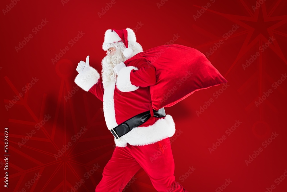 Poster composite image of positive santa with a sack and thumbs up