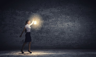 Fototapeta premium Businesswoman with lantern