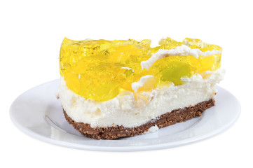 Piece of cheesecake with jelly on a plate