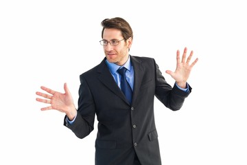 Businessman standing with fingers spread out