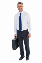 Smiling business man holding briefcase