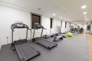 Fototapeta na wymiar Treadmills in hotel gym 