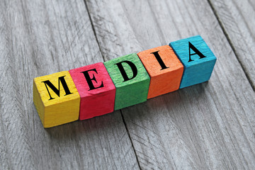word media on colorful wooden cubes
