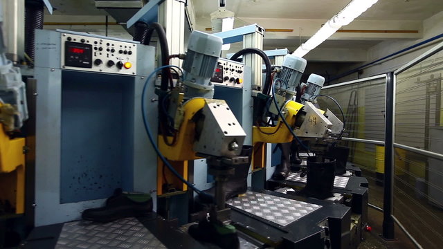 Modern machine in workshop of footwear production