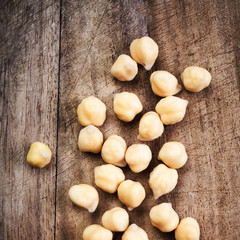Fresh Prepared Chickpeas over rustic wooden table close up.
