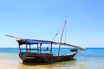 Fototapeta na wymiar Traditional fisherman boat lying near the beach