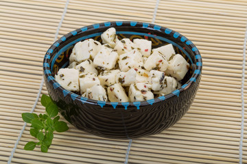 Cheese with spices and oil