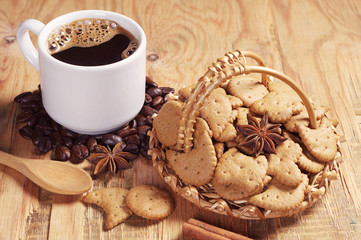 Small cookies in wicker basket and coffee