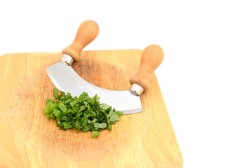 Chopped fresh basil leaves with a rocking knife