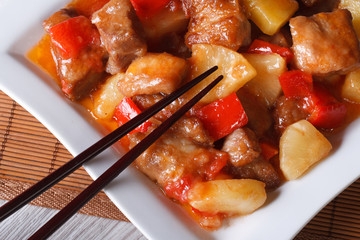 pork meat with sweet and sour sauce macro. horizontal top view