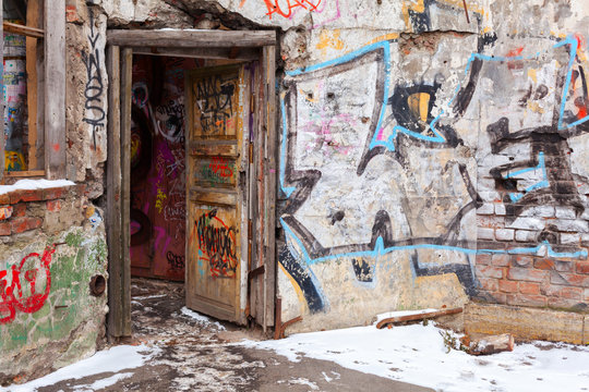 Old courtyard walls painted with colorful graffiti