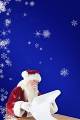 Composite image of santa reads a long list