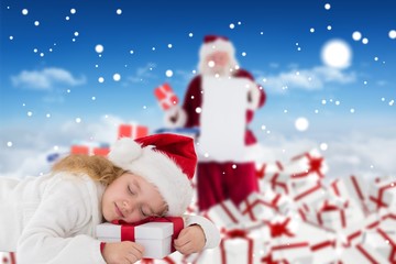 Composite image of cute girl with gift