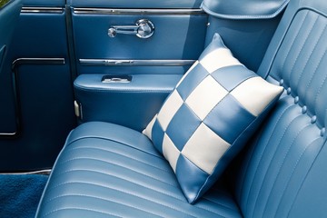 The backseat of a classic car - 75089577