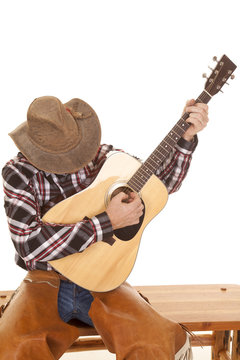 cowboy play guitar head down
