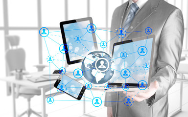 Obraz na płótnie Canvas Business man using tablet PC and smartphone social connection