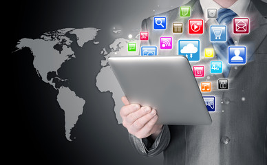 Business man use tablet pc with colorful application icons