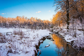 Stream in a snow covered meadow, in rural York County, Pennsylva