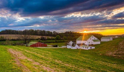 Fototapeta na wymiar Sunset over a farm in rural York County, Pennsylvania.