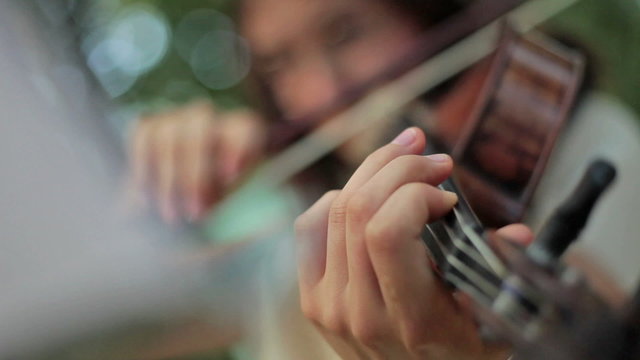 playing violin outdoors