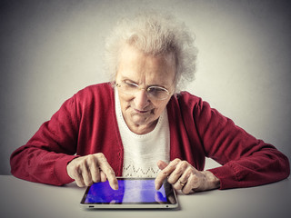 A smart grandma using a tablet