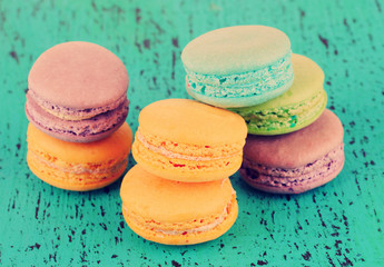 Macaroons on wooden surface close-up