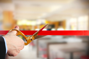 Grand opening, cutting red ribbon