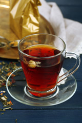 Beautiful vintage composition with herbal tea, on wooden table