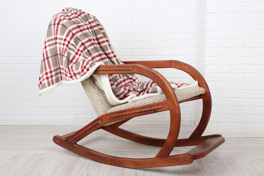 Comfortable rocking-chair with rug