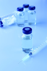 Vaccine in vial with syringe