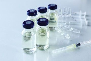 Vaccine in vial with syringe