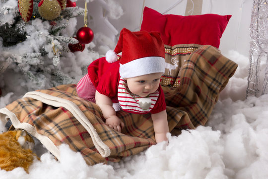 Little girl, baby in Christmas interior