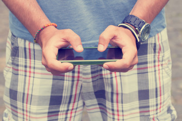 Typing messages on a smartphone.