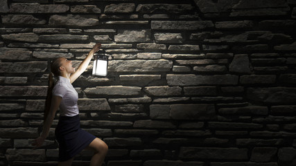 Businesswoman with lantern