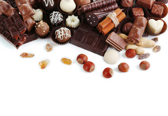 Delicious chocolate candies on white background