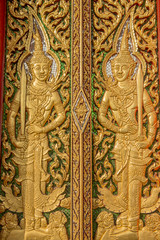 wood carving door decorated in the temple ,Thailand