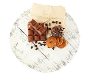 Pieces of chocolate with envelopes and cookies