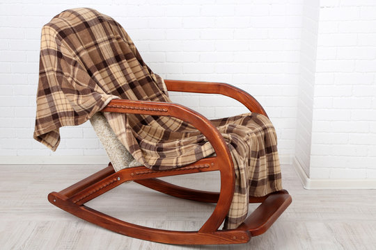 Rocking chair covered with plaid