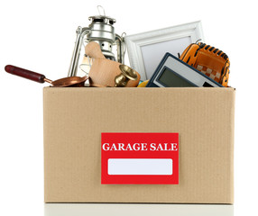 Box of unwanted stuff ready for a garage sale, isolated on